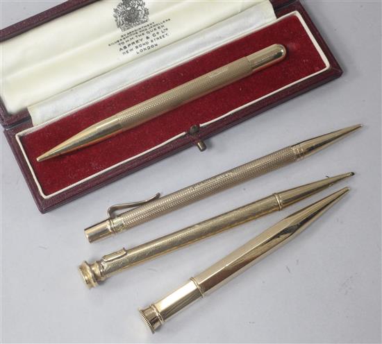 Four 9ct gold overlaid pencils including one in Asprey & Co fitted box and two by Sampson Mordan.